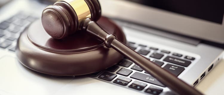 Justice gavel on laptop computer