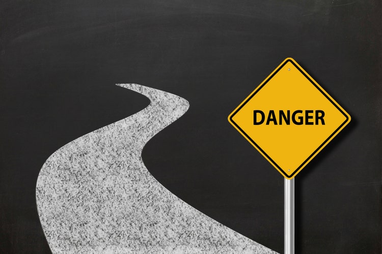 Danger ahead warning sign blackboard way