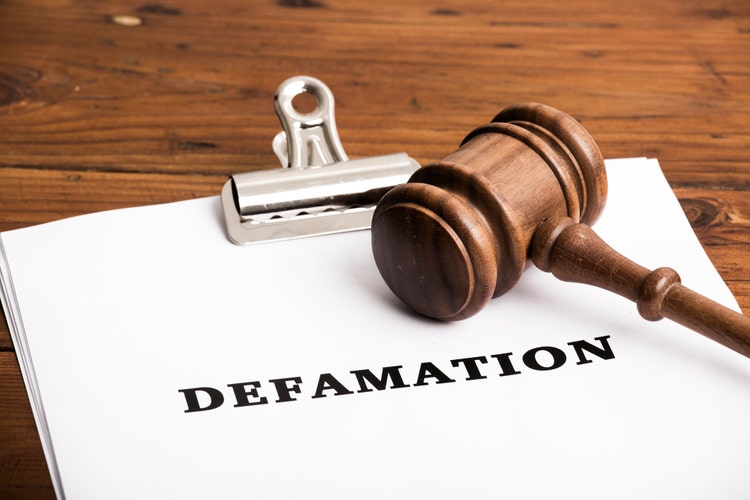 Defamation file in court with gavel