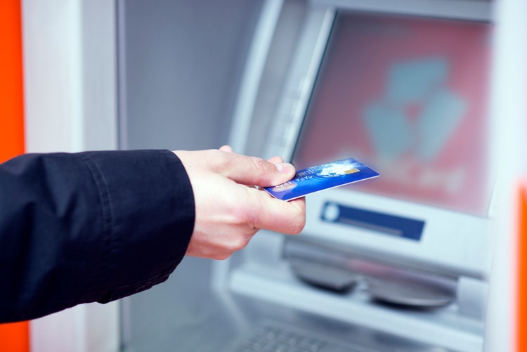 man putting his credit card