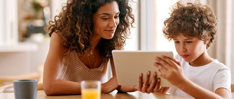 Shot of a young woman and her son using a digital tablet together in the morning at home